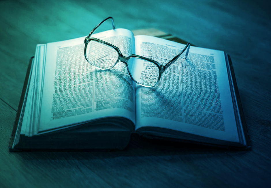 A pair of glasses on a book