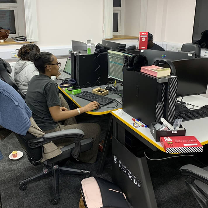 Students Working on Computers in the Grand Challenge Project: 24-Hour Hackathon Sponsored by iGaming.com