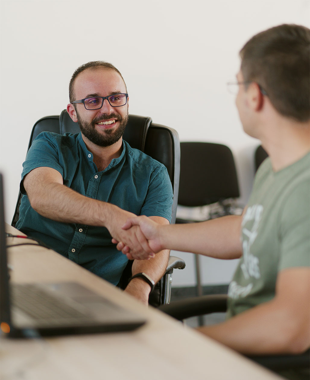 Employees shaking hands.