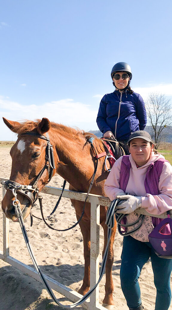 Two People at an Outdoor Horseback Riding Event