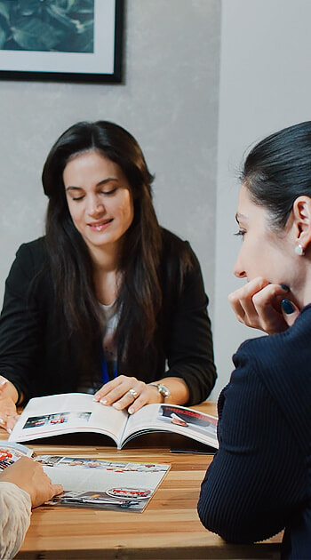 iGaming.com Colleagues Reviewing Materials Together at the Office