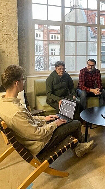 Two iGaming.com Colleagues Collaborating in a Meeting Room