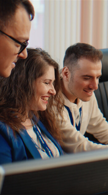 Two iGaming.com Colleagues Reviewing Documents Together