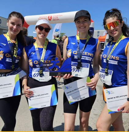 iGaming.com Employees Holding a Trophy and Certificates After Completing the Business Run Event