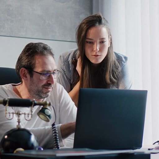 iGaming.com Colleagues Collaborating on a Laptop in an Office